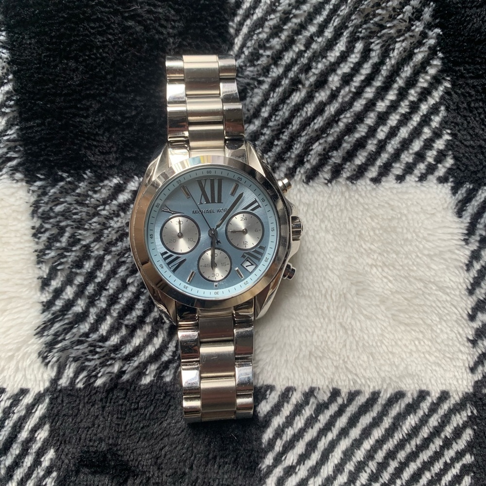 Silver Micheal Kors watch with blue face